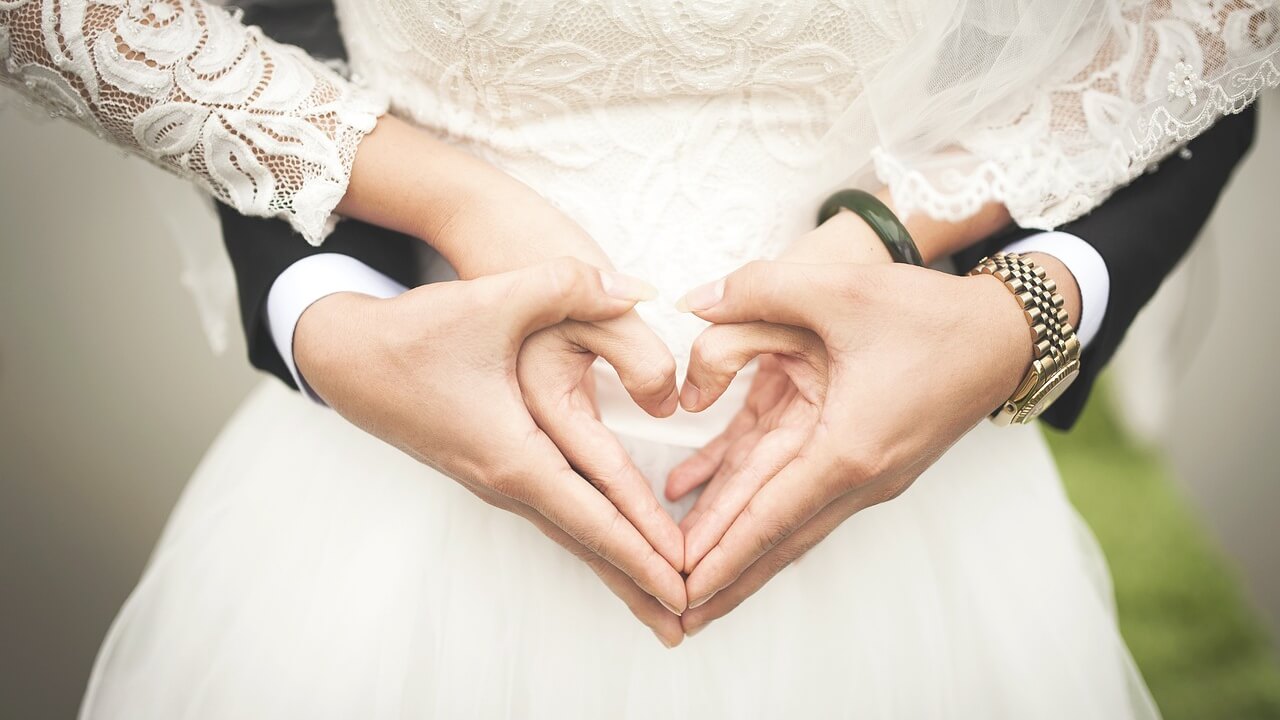 Couple with Hands in Shape of Heart